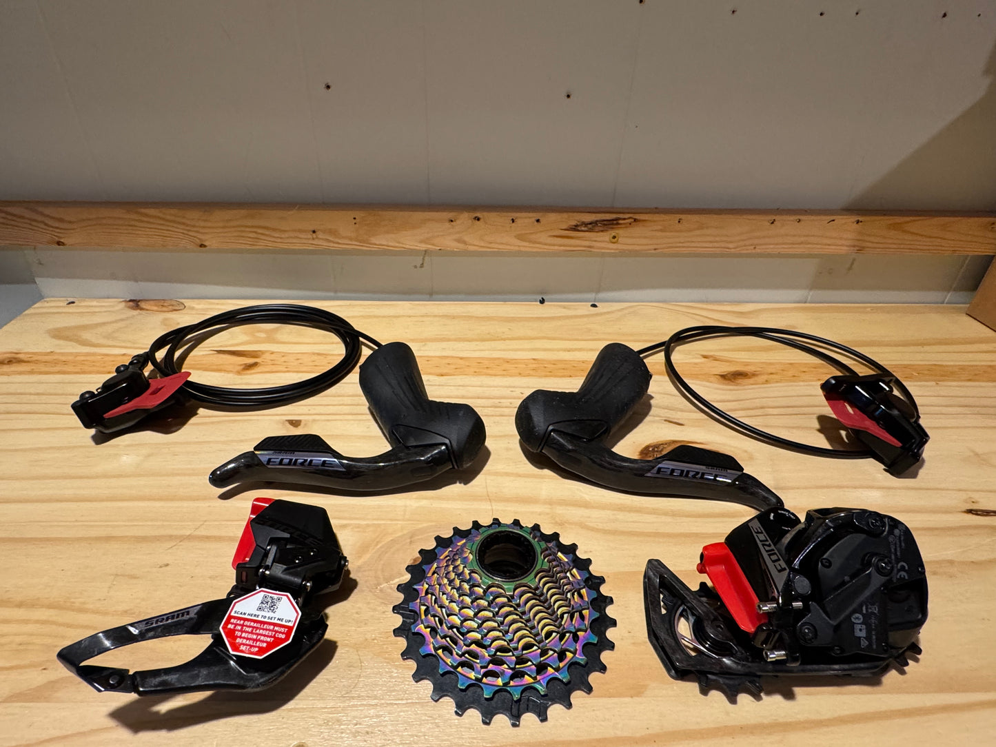 SRAM Force eTap AXS Road Groupset - 2x12-Speed HRD Shift/Brake Levers, Calipers, Rotors F/R Derailleurs E1. Crankset d2. Red oil slick cassette.